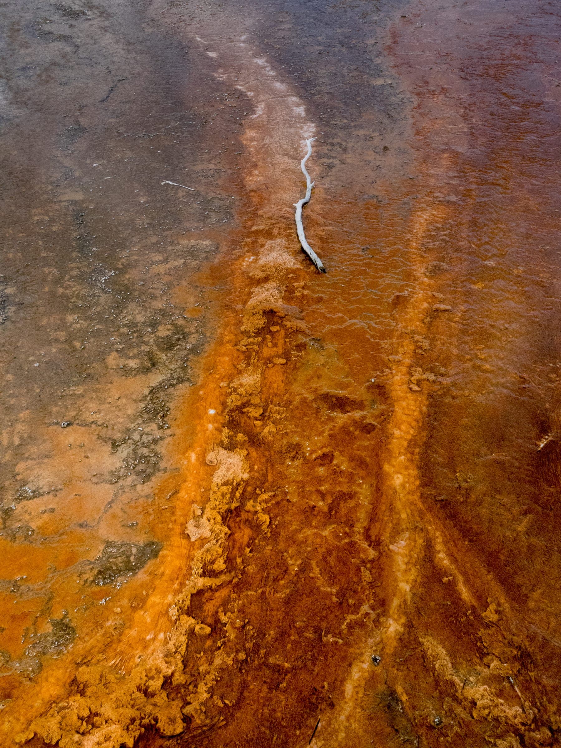 Grand Prismatic runoff seen as abstract orange and rust brushstrokes