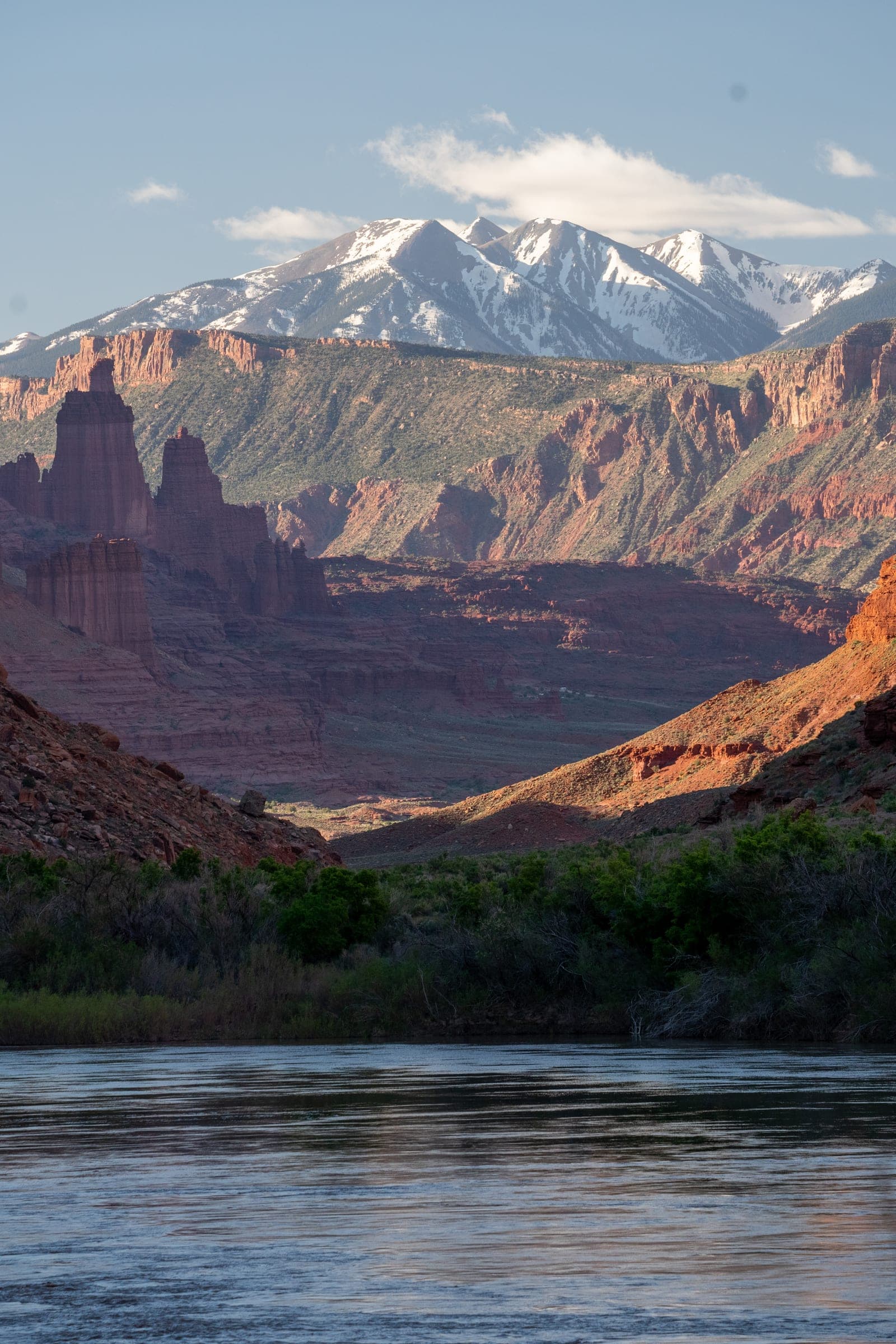 La Sals and Fisher Towers above the Colorado River at golden hour