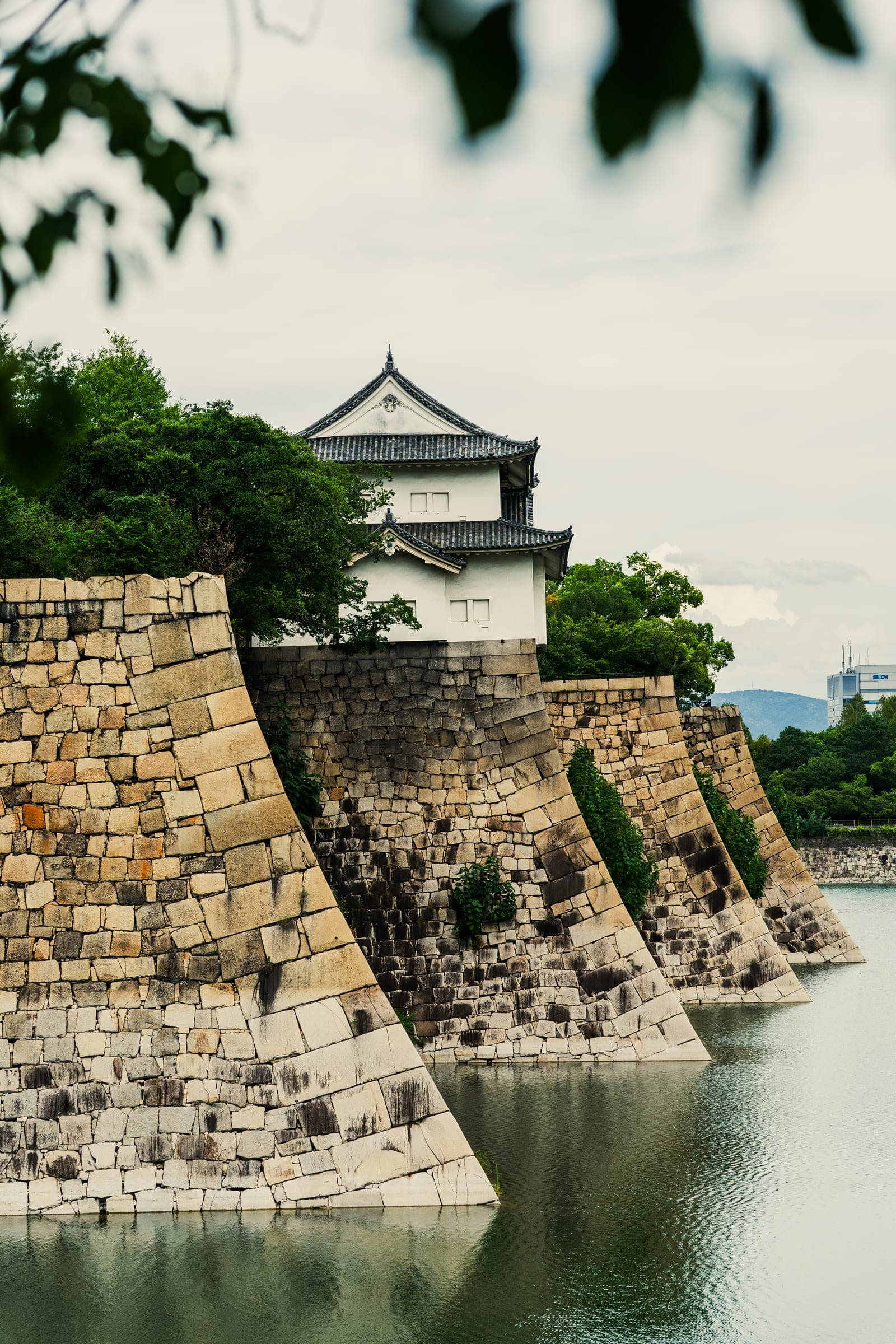 Osaka Castle turret above its stone moat walls