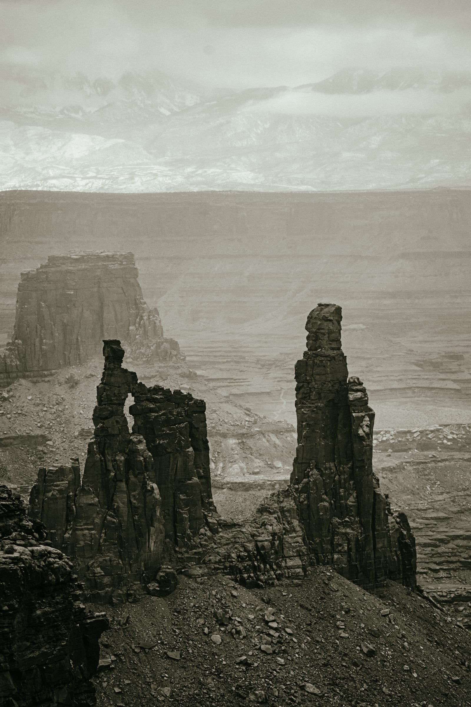 Sepia Washer Woman spires rising out of storm haze