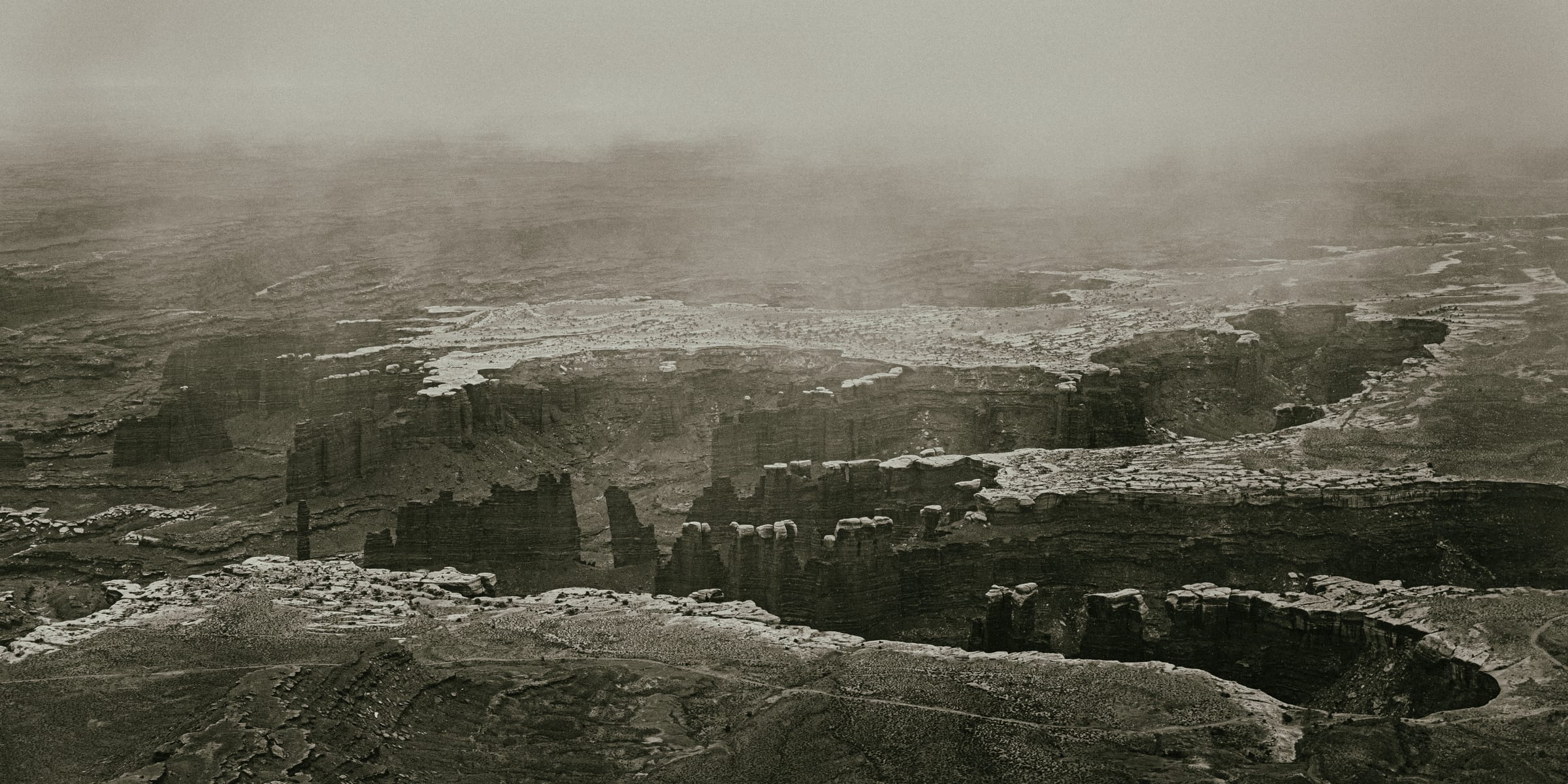 Sepia fog rolling through Canyonlands mesas
