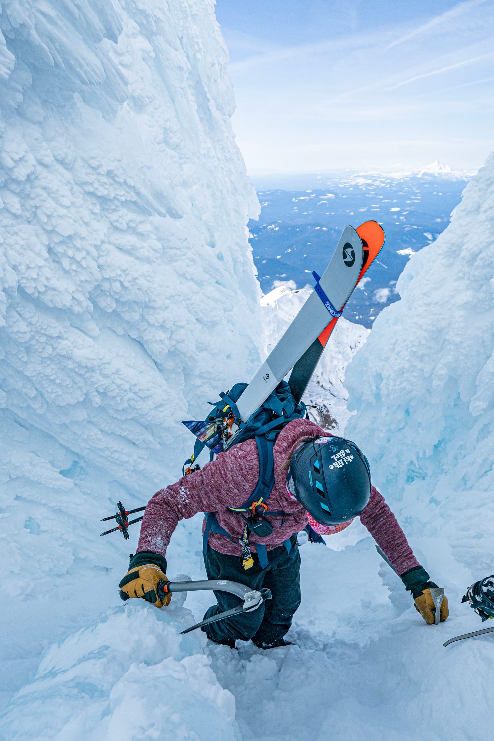 Ski mountaineer climbing a rime-ice chimney